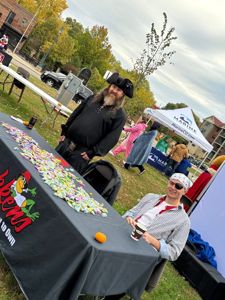 Volunteers handing out treats at a table