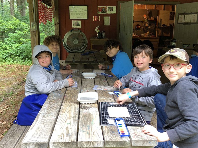 Campers working on a craft project
